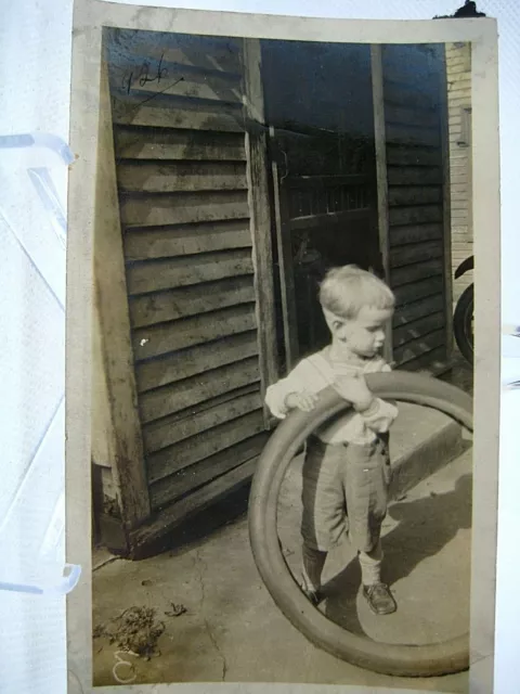 OP394 ORIGINAL found photo 1930s/40s? little kid with tube tire front door