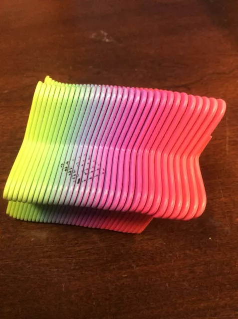 Collectible Rainbow Plastic Slinky Enron Logo On Edge HistoricalMemorbillia.com Collectible Rainbow Plastic Slinky Enron Logo On Edge HistoricalMemorbillia.com