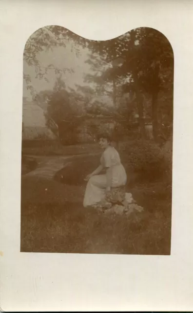 PHoto ID Card Woman Sitting on Stones in a Park