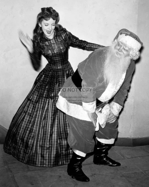 Actress Ida Lupino "Spanking" Santa Claus 8X10 Christmas Publicity Photo (Dd302)