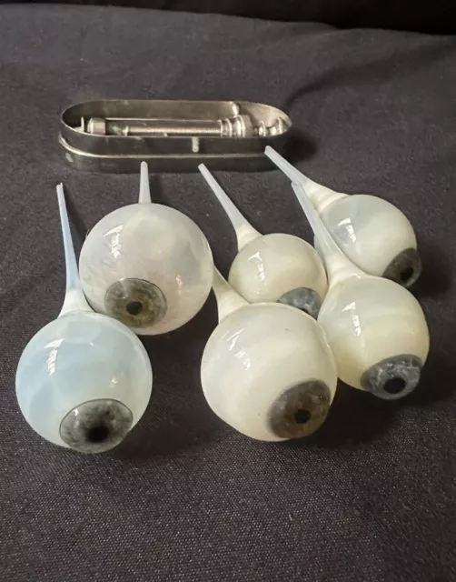 A set of 6 hand blown Glass prosthetic EYES with their original glass stems 👀