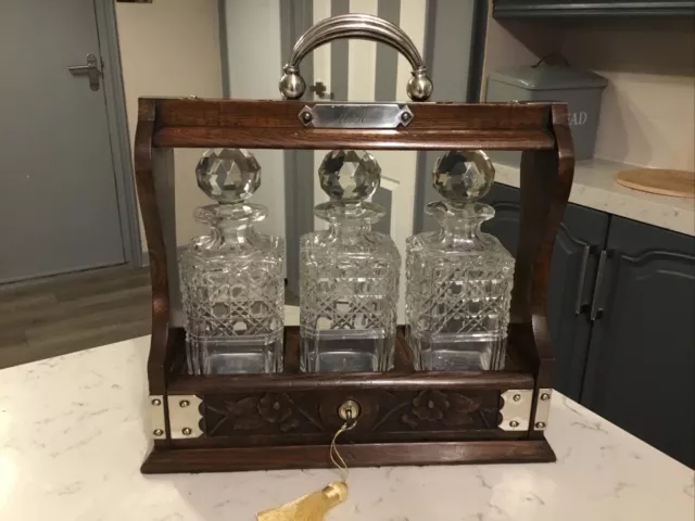 Lovely Edwardian Antique Three Bottle,Carved Oak Tantalus With Key Circa 1900.