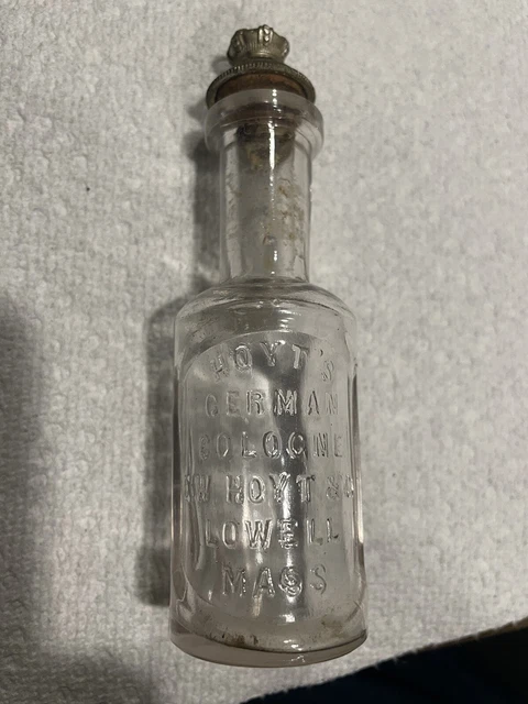 Vintage Hoyts German Cologne Lowell Mass. Embossed Glass Bottle With Top. Vintage Hoyts German Cologne Lowell Mass. Embossed Glass Bottle With Top.