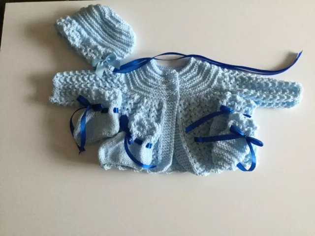 New hand knitted 4 piece matinee set in baby blue to fit 16"