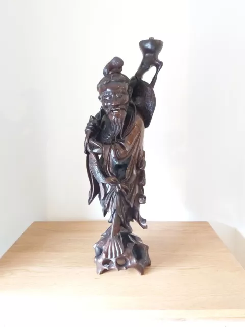 A Large Chinese Hardwood Root Carved Fisherman Figure Lampstand.