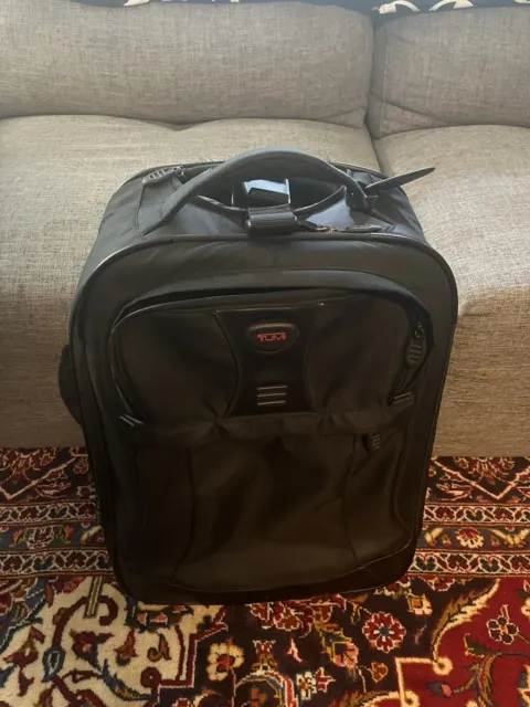 TUMI  Short Trip Expandable Spinner Upright Carry On Luggage.