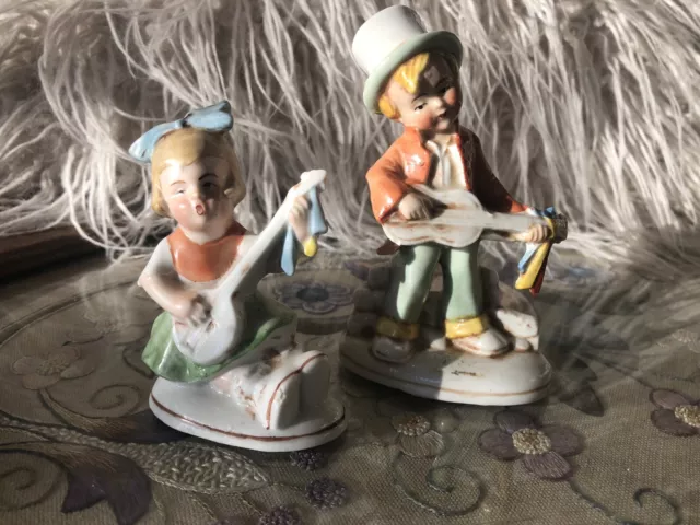 Two Vintage Boy and Girl Musician Foreign Pottery Figurines