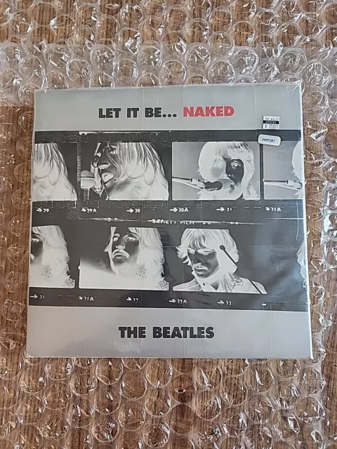 The Beatles 'Let It Be... Naked' factory sealed 2003 U.K. LP set w/ bonus 7" rec