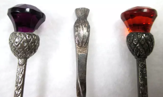 THREE VINTAGE  COLLECTIBLE SPOONS  w THISTLES:  RED and PURPLE JEWELED TOPS