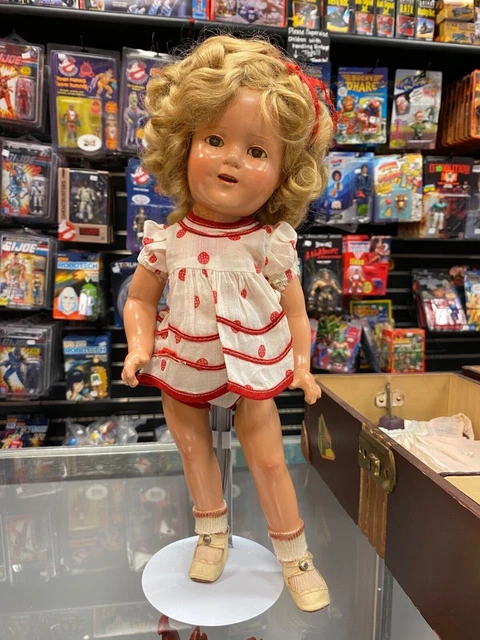 1930's Shirley Temple Doll with wooden case, clothes, ribbons, shoes and handker