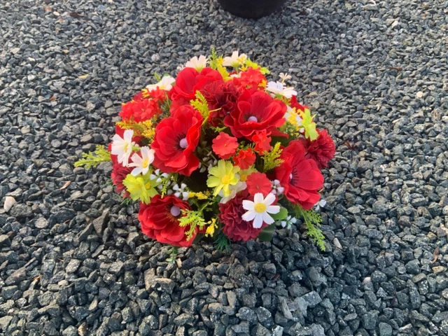 artificial red anemone flower  arrangement in grave/memorial/crem pot