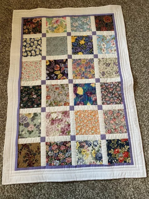 Machine pieced and quilted scrappy lap/wheelchair quilt made in WY in 2024