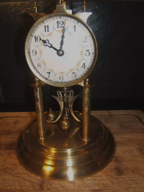 400 day anniversary/Torsion clock  by Kaiser Cream and white  &Brass glass dome