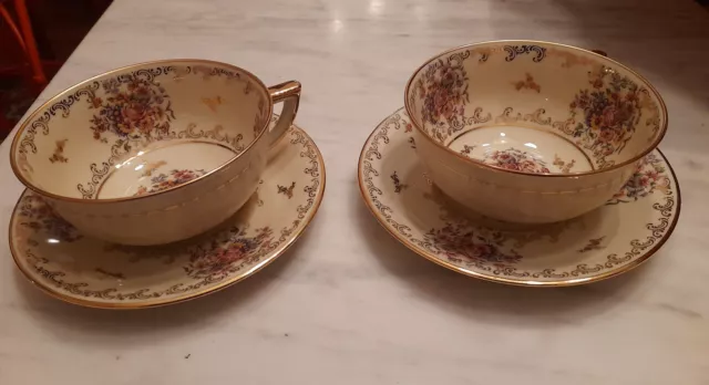 Deux déjeuners en porcelaine de Limoges décor floral doré et bordeau. Etat neuf