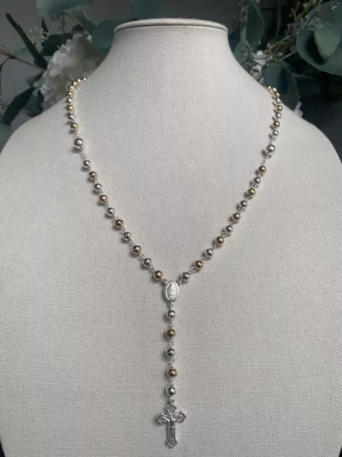 Silver 925 rosary necklace 10k gold laminated 24 inches , 18 grams weight . Silver 925 rosary necklace 10k gold laminated 24 inches , 18 grams weight .