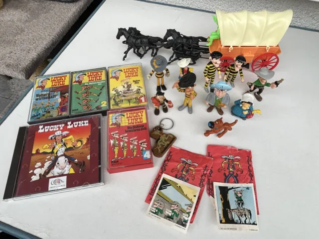 Konvolut Lucky Luke Artikel - CD , Cassetten, Figuren und Postkutschen usw.
