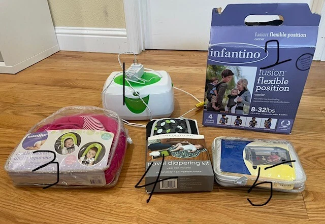 baby carrier, wipe warmer, diapering kit, etc.
