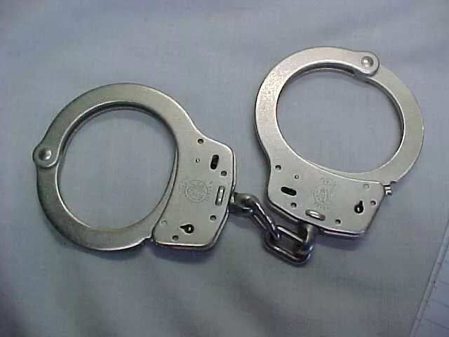 Pair Of " M-100- Smith & Wesson " Hand Cuffs
