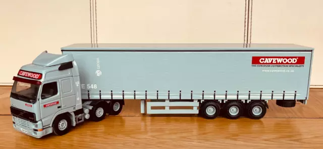 Tekno Volvo Fh Globetrotter With Curtainside Trailer In The Livery Of Cavewood