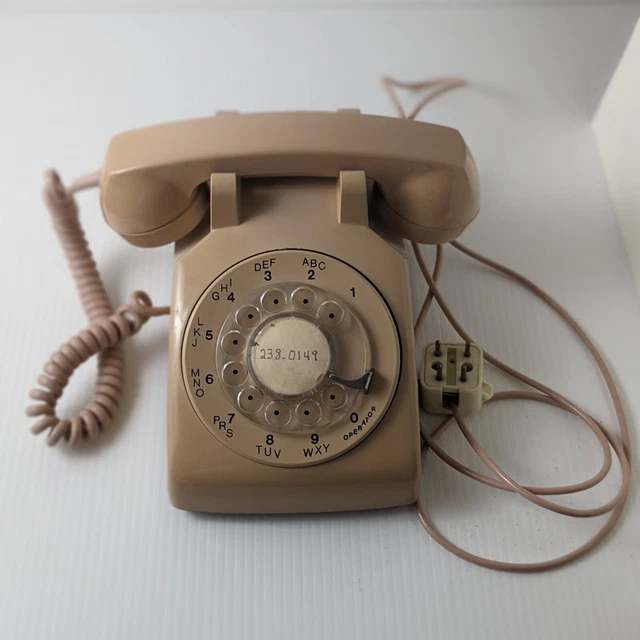 Teléfono de escritorio con esfera giratoria probado y en funcionamiento - Northern Telecom - beige vintage década de 1980