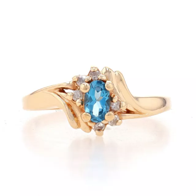 Yellow Gold Blue Topaz & Diamond Bypass Ring - 10k Oval .64ctw