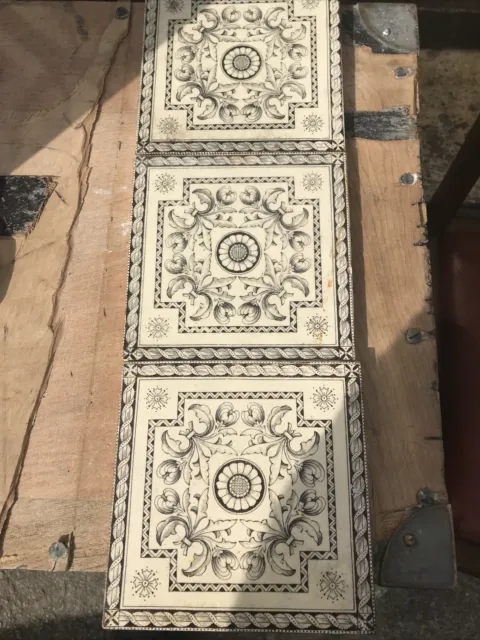three fireplace tiles