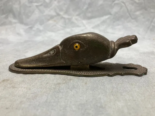 H L Judd & Co -Duck head paper clip. Cast iron.  Glass eyes. Early 20th century