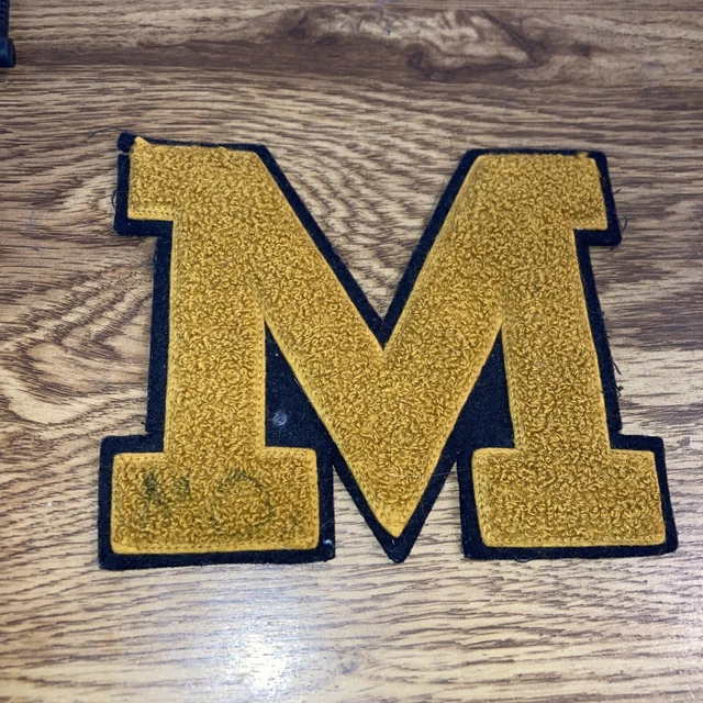 Vintage Varsity Letter: M Goldish color with Black Outline