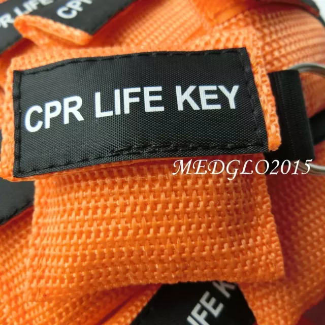 50pcs CPR Máscara de primeros auxilios de formación naranja con bolsa de llavero