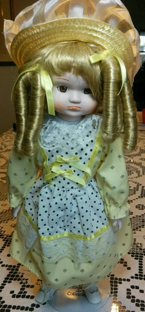 Heritage Mint Blonde Curly Hair Porcelain Doll Girl Yellow Clothing & Hat 16"