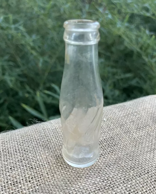 Vintage Miniature Bottle Looks Like Pepsi Bottle With Swirls Embossed Around It.