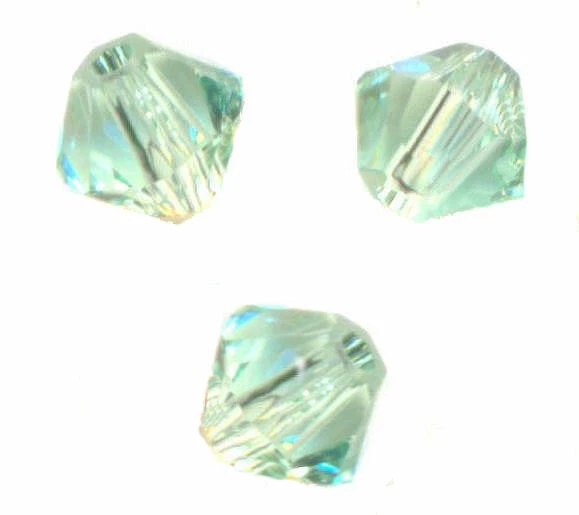site parisien  40 PERLES TOUPIES SWAROVSKI   5mm   CHRYSOLITE