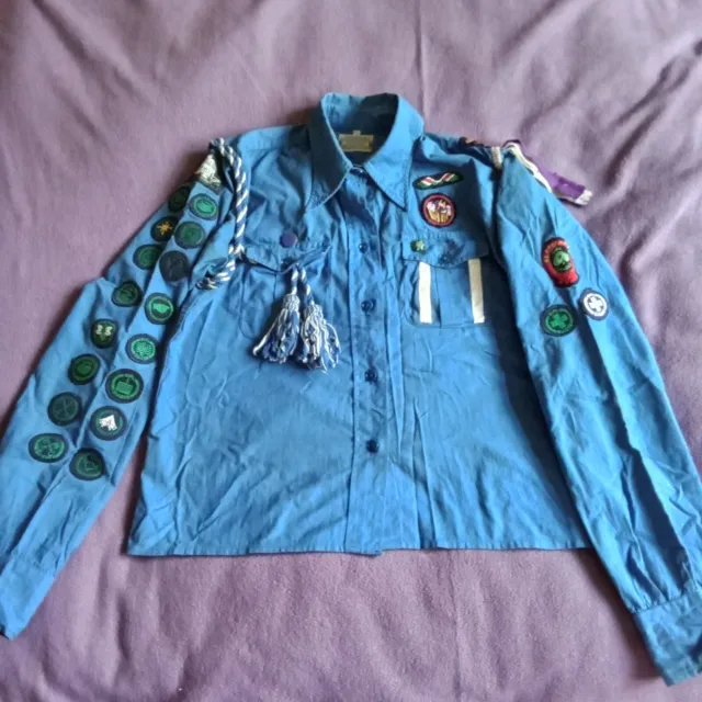 Vintage Girl Guides blouse with numerous badges, dating from 1965 or earlier