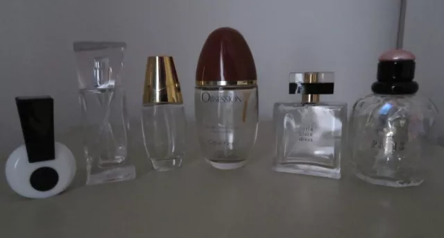 6 Empty purfume bottles. Paris,Hypnoise,beautiful,obsession,exclamation.