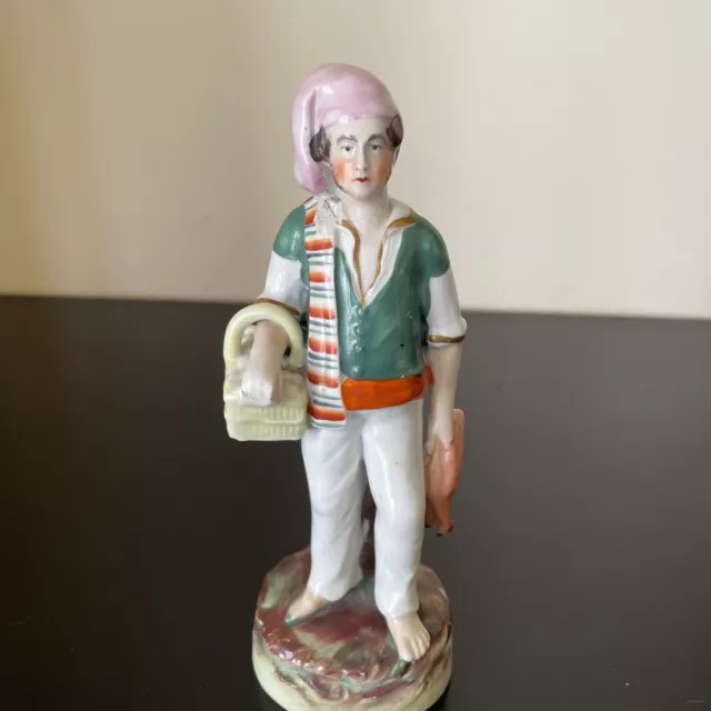 Antique Mid-19th-Century Staffordshire Figurine of a Boy with Basket And Ducks