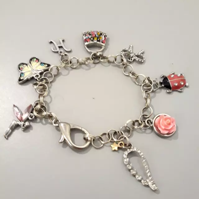 Silver Tone Charm Bracelet 8 Charms Lady Bug Fairy Butterfly Purse Bow Rose