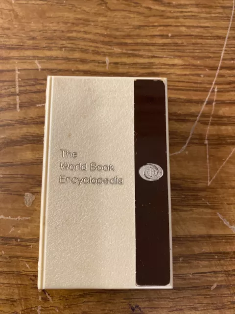 Vintage Plastic Advertising Coin Bank - THE WORLD BOOK ENCYCLOPEDIA