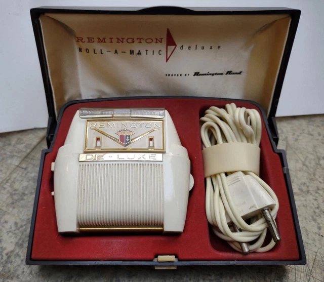 Remington roll-a-matic De-luxe mains dual voltage electric razor, in box 1975.