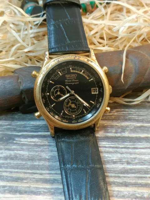 Seiko quartz discount world timer gold