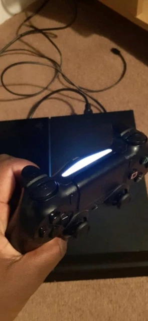 ps4 console with controller and games