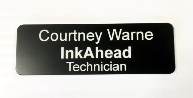 Black Name Badge with white text and pin attached Laserable Plastic 70 x 23 mm