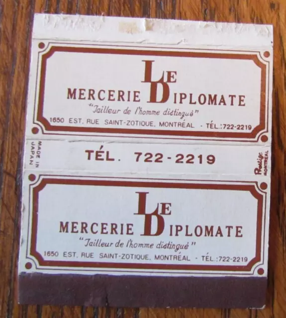 Matchbox Cover: Le Diplomate Mercerie Montreal, Quebec Empty Matchcover -C15
