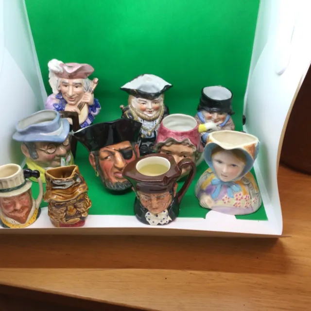 A collection of 10  toby jugs To Hand-Painted Toby Jugs￼