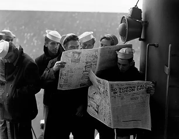 Sailors on the USS President Hayes reading American newspapers upo- Old Photo