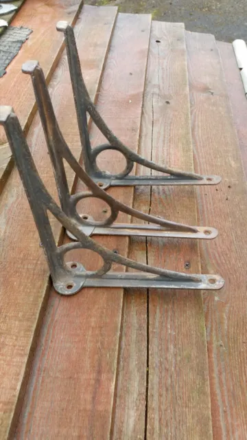 A set of three  reclaimed Victorian cast iron shelf brackets
