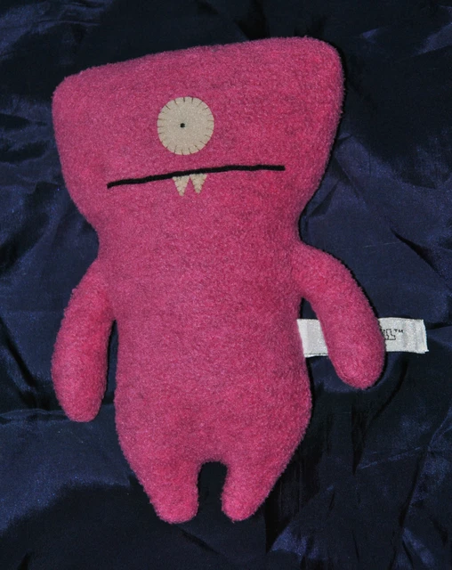 Doudou Peluche Poupée Monstre UGLYDOLL Rose Mauve Hochet 20 Cm TTBE