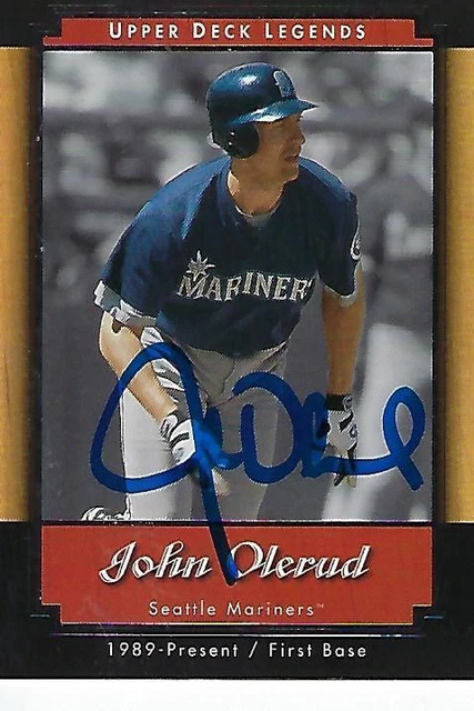 John Olerud of the Seattle Mariners looks on from the dugout before a
