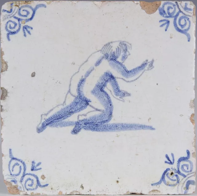 Nice Dutch Delft Blue tile, playing figure, mid 17th century.