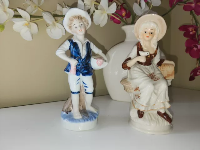 Vtg Set of 2 Porcelain Figurine Victorian Couple Girl w.  Bird & Boy w. Grapes