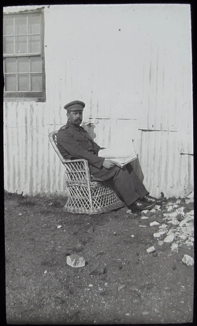 Glass Magic Lantern Slide SOLDIER READING A PAPER IN WICKER CHAIR C1910 PHOTO